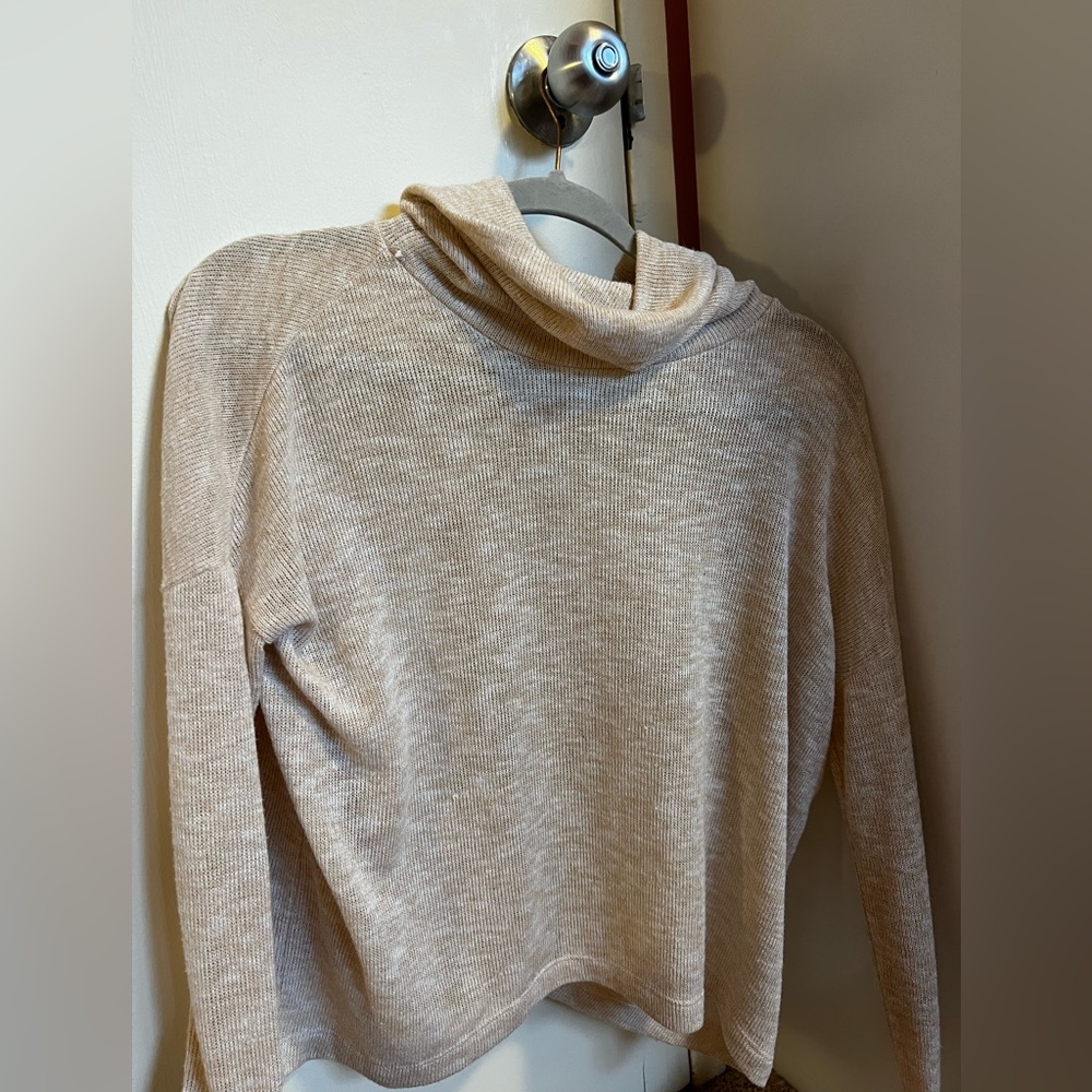 Super stylish and trendy turtleneck shirt with open back. perfect for fall!